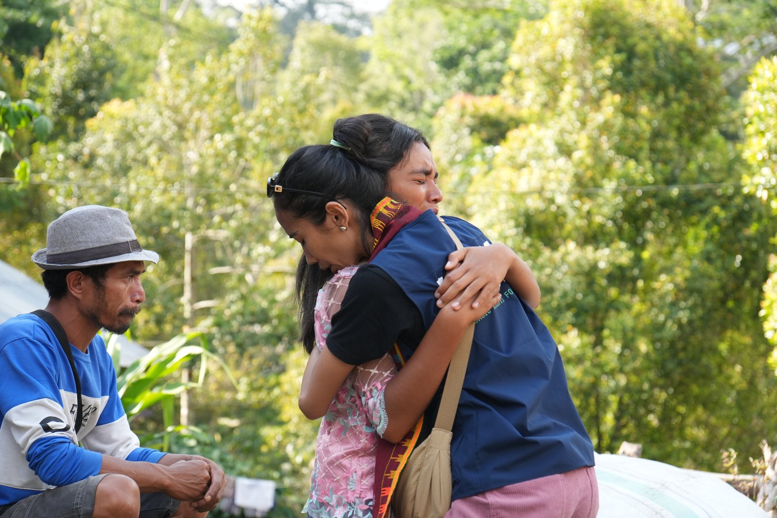 Prili's family embracing after the earthquake
